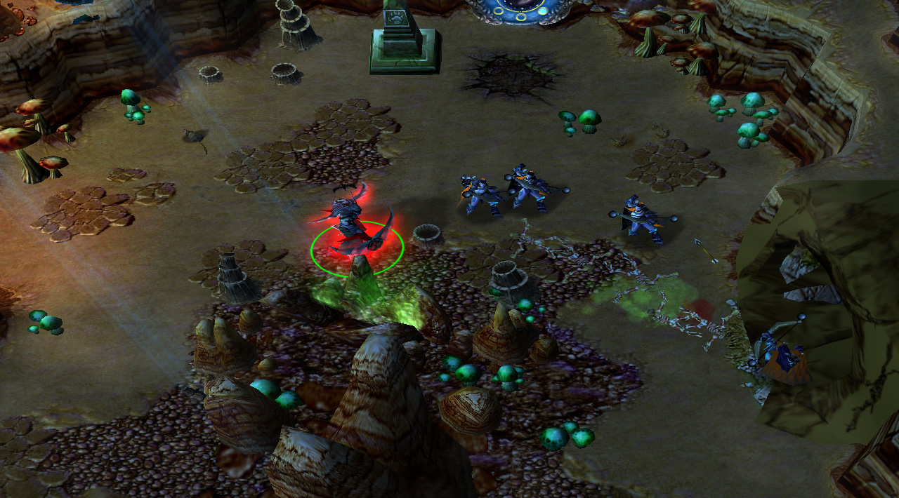 A demon hunter hero fights with friendly troops inside a dusty cave